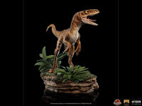 Iron Studios 1/10 scale Velociraptor statue from The Lost World, featuring a detailed brown dinosaur on a jungle base.