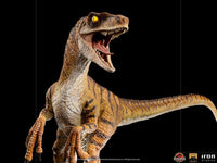 Iron Studios 1/10 scale Velociraptor statue from The Lost World, featuring detailed brown striped skin and open jaws.