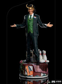 Iron Studios Loki President Variant 1/10 scale statue in a green suit with horned helmet, standing on a themed base.