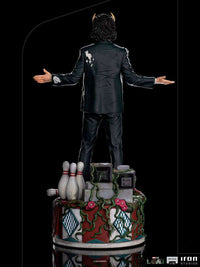 Back view of Iron Studios Loki President Variant 1/10 scale statue featuring a damaged suit on a themed bowling base.