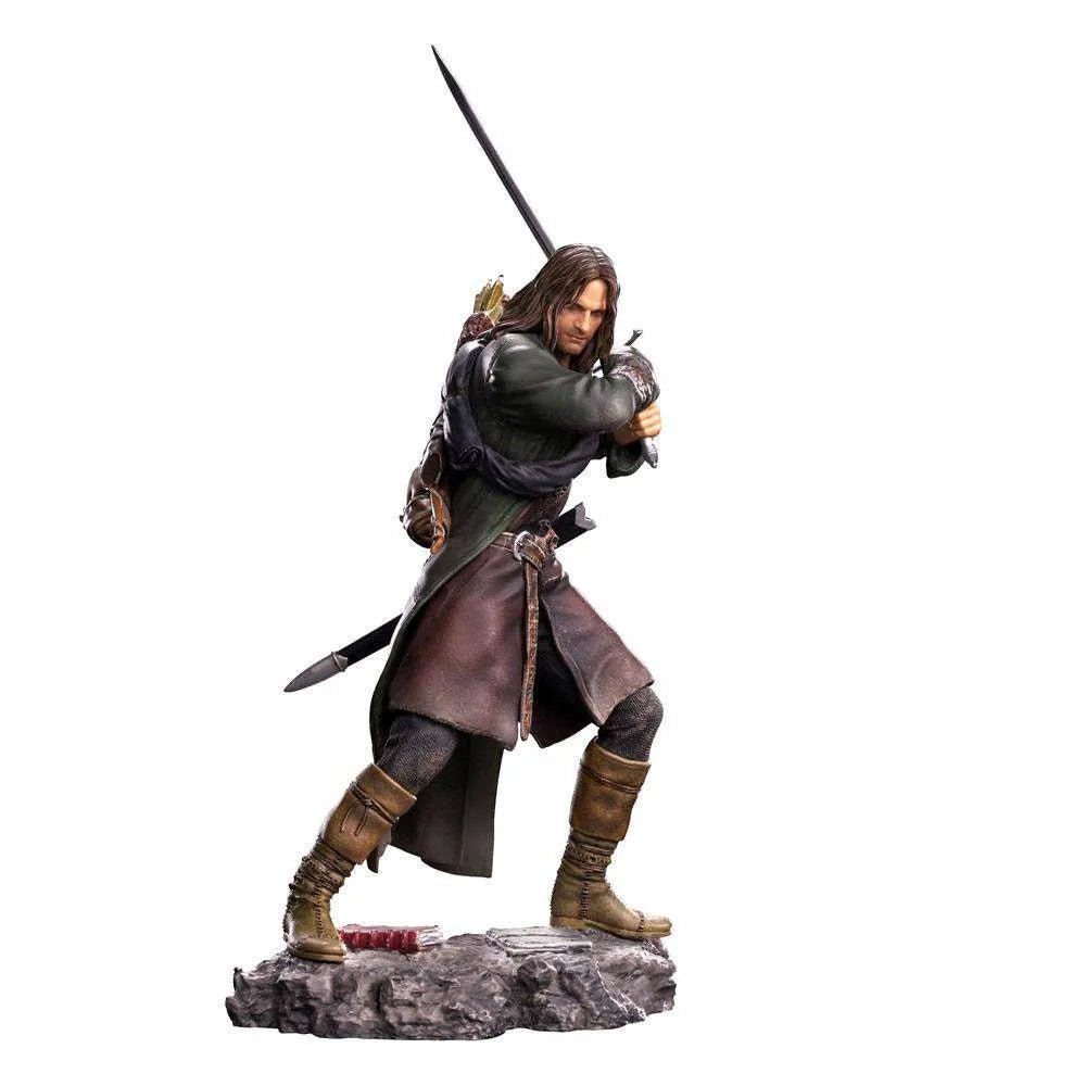 Iron Studios 1/10 scale Aragorn statue from Lord of the Rings, featuring the ranger in a dynamic sword-wielding pose.