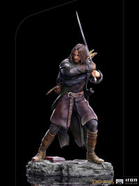 Iron Studios 1/10 scale Aragorn statue from Lord of the Rings, featuring the character in a dynamic sword-wielding pose.