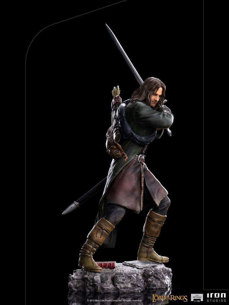 Side view of Iron Studios 1/10 scale Aragorn statue, featuring detailed ranger clothing, sword, and rocky base.