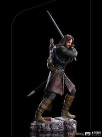 Side view of Iron Studios 1/10 scale Aragorn statue, featuring detailed ranger clothing, sword, and rocky base.