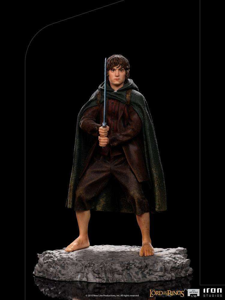 Front view of the 12cm Iron Studios Frodo BDS Art Scale statue holding Sting on a rocky base.