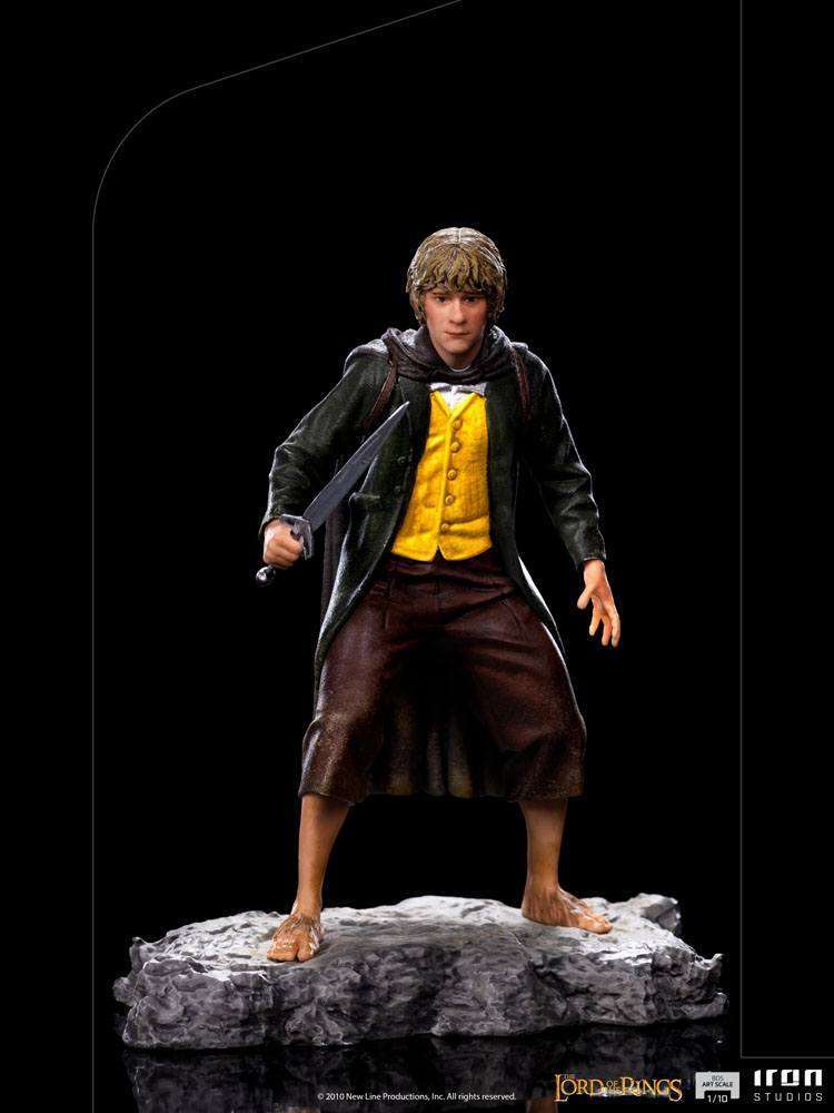 Iron Studios 1/10 scale Merry statue from Lord of the Rings, featuring the hobbit holding a sword on a rocky base.