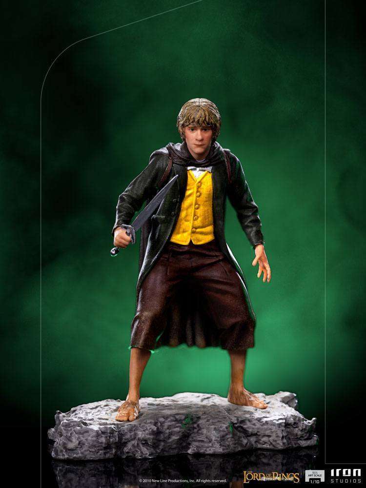 Iron Studios 1/10 scale Merry statue from Lord of the Rings, featuring the hobbit in a yellow vest and sword on a base.