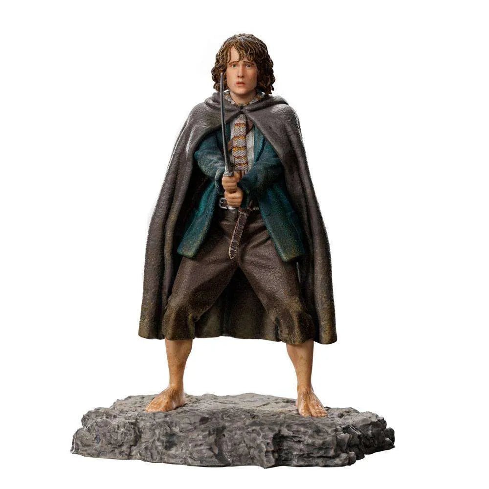 Front view of Iron Studios 1/10 Pippin statue, featuring the hobbit in a cloak holding a sword on a rocky base.