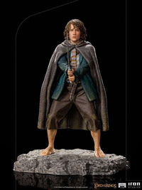 Iron Studios 1/10 scale Pippin statue from Lord of the Rings, featuring the hobbit holding a sword on a rocky base.