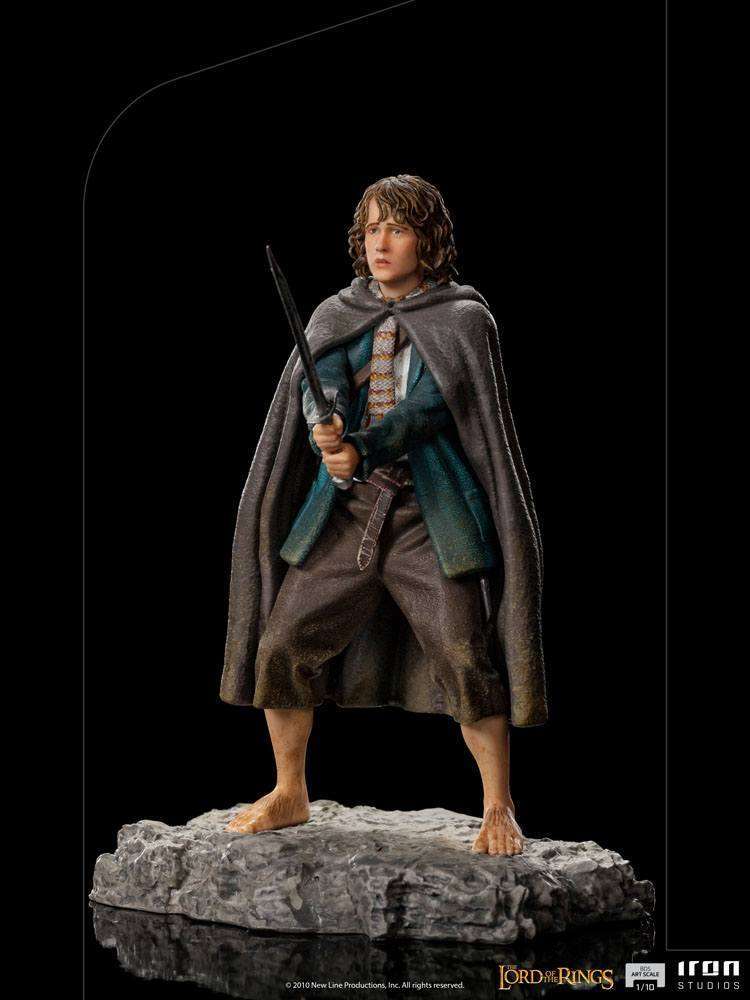 Iron Studios 1/10 scale Pippin statue from Lord of the Rings, featuring the Hobbit holding a sword on a rocky base.
