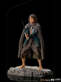 Iron Studios 1/10 scale Pippin statue from Lord of the Rings, featuring the Hobbit holding a sword on a rocky base.