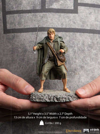Iron Studios 1/10 scale Samwise Gamgee statue holding a sword, standing on a rocky base, held in hands.