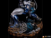 Side view of the Iron Studios Apocalypse 1/10 scale statue featuring metallic blue armor and a rocky debris base.