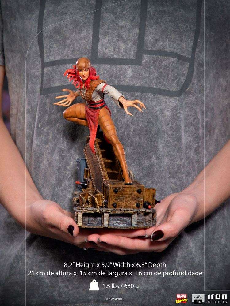 Iron Studios Lady Deathstrike 1/10 scale statue with red hair and long claws, held in hands, front view.