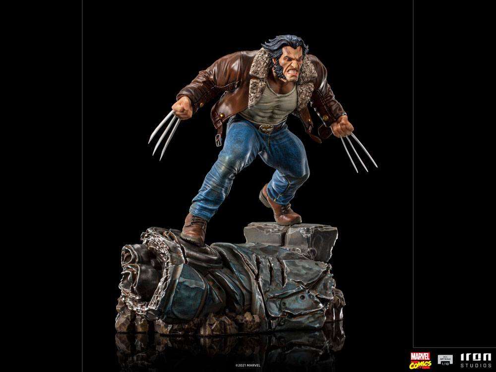 Iron Studios 1/10 Logan statue showing Wolverine in a brown leather jacket and jeans with claws extended on a base.