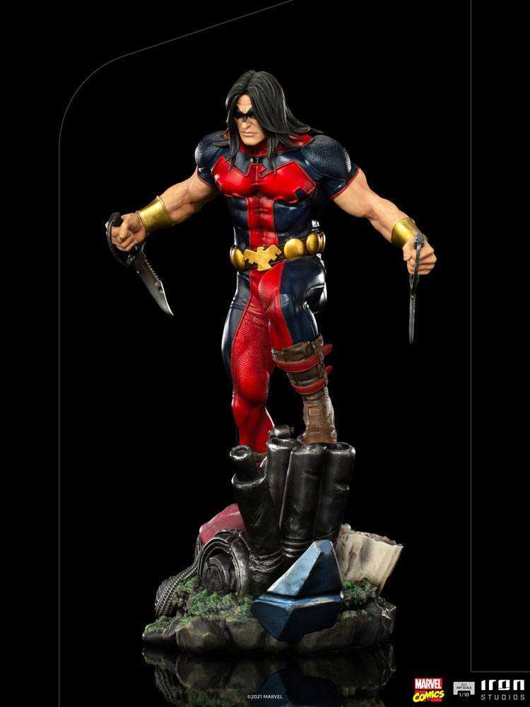 Iron Studios 1/10 Warpath X-Men statue in a dynamic pose, holding two knives on a detailed rubble base.