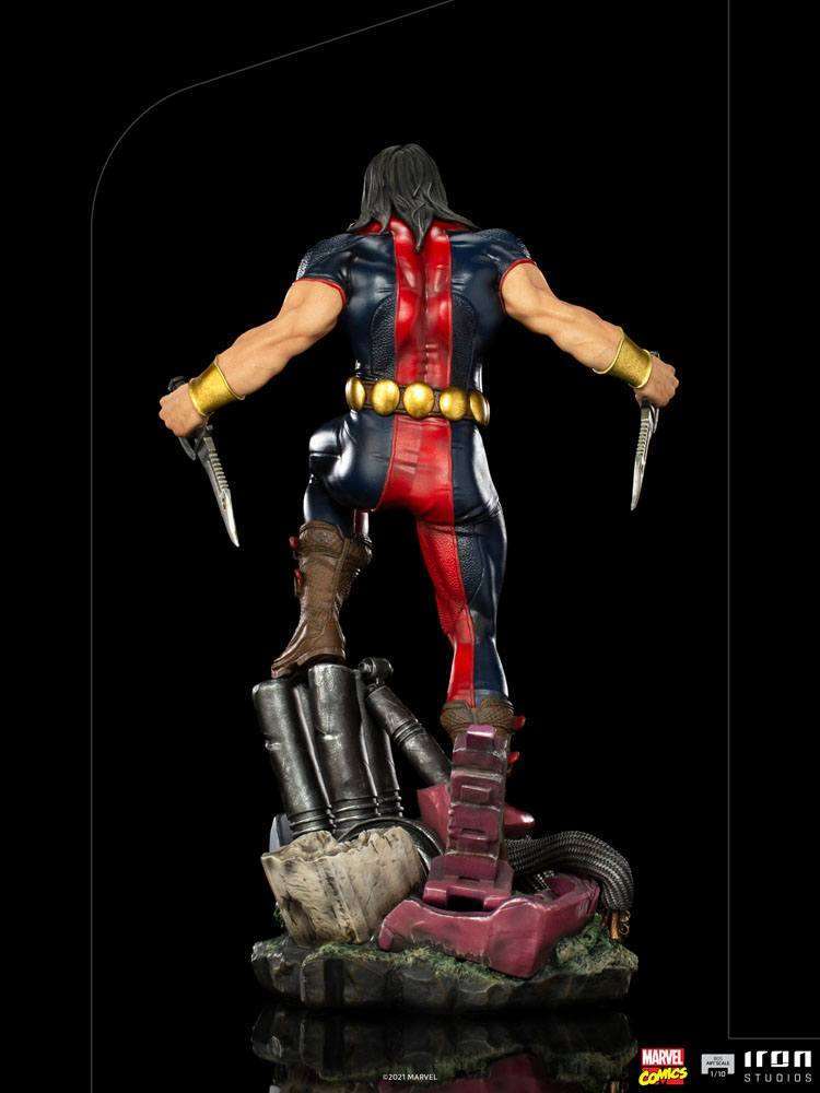 Back view of Iron Studios Warpath 1/10 scale statue featuring blue and red suit, gold belt, and dual knives.
