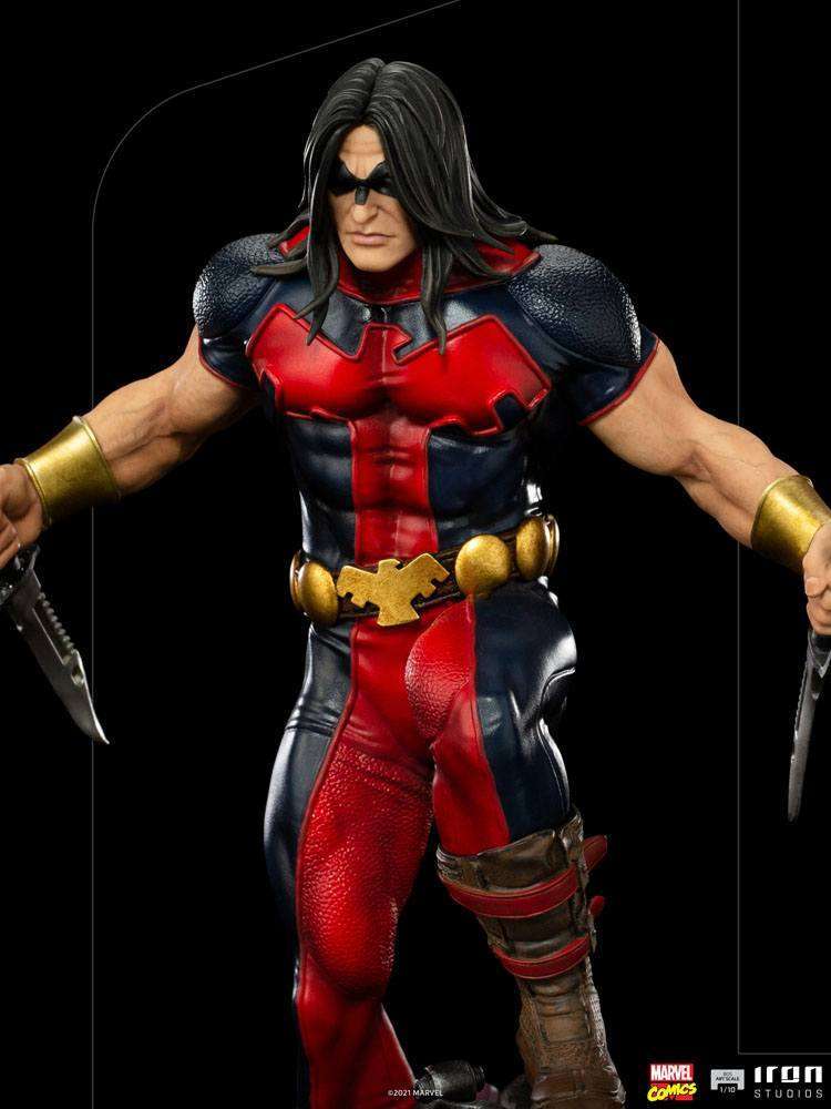 Iron Studios 1/10 Warpath statue in a dynamic pose, wearing a red and blue suit with gold accents and holding two knives.