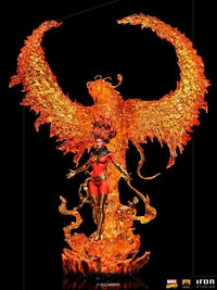Iron Studios 1/10 Phoenix statue featuring Jean Grey in a red and gold costume before a large, translucent fire phoenix.