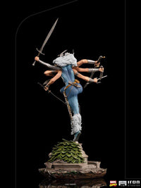 Back view of Iron Studios Spiral 1/10 scale statue featuring six arms, white hair, and blue suit on a leafy base.