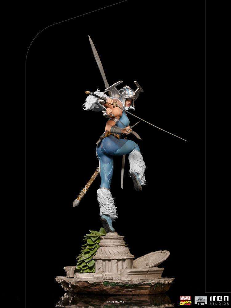 Iron Studios 1/10 Spiral X-Men statue in a dynamic side view, wielding multiple swords atop a stone-ruin base.