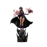 Iron Studios Evil-Lyn 1/10 scale statue featuring a purple costume, black cape, and magic effects on a rocky base.