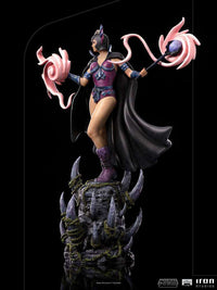 Iron Studios Evil-Lyn 1/10 scale statue in a side view, featuring purple armor, a black cape, and swirling pink magic.