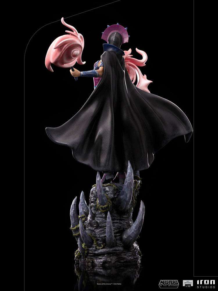 Back view of Iron Studios Evil-Lyn 1/10 scale statue featuring a flowing black cape and pink staff on a rocky base.
