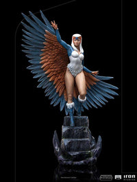 Iron Studios Sorceress 1/10 scale statue featuring detailed blue and brown wings on a rocky base, front view.
