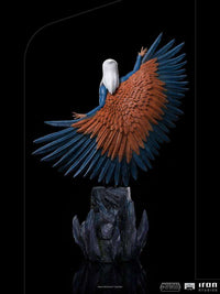 Back view of Iron Studios Sorceress 1/10 scale statue featuring detailed orange and blue wings on a rocky base.