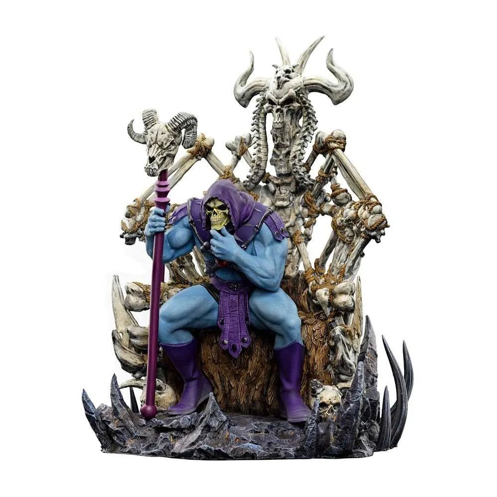 Iron Studios Skeletor on Throne Deluxe 1/10 scale statue featuring a blue-skinned Skeletor holding a staff on a bone throne.