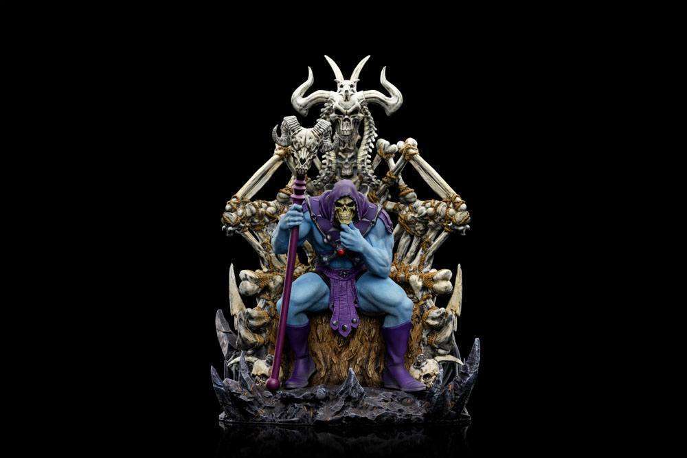 Front view of Iron Studios Skeletor on Throne Deluxe statue, featuring a blue-skinned Skeletor holding a Havoc Staff.