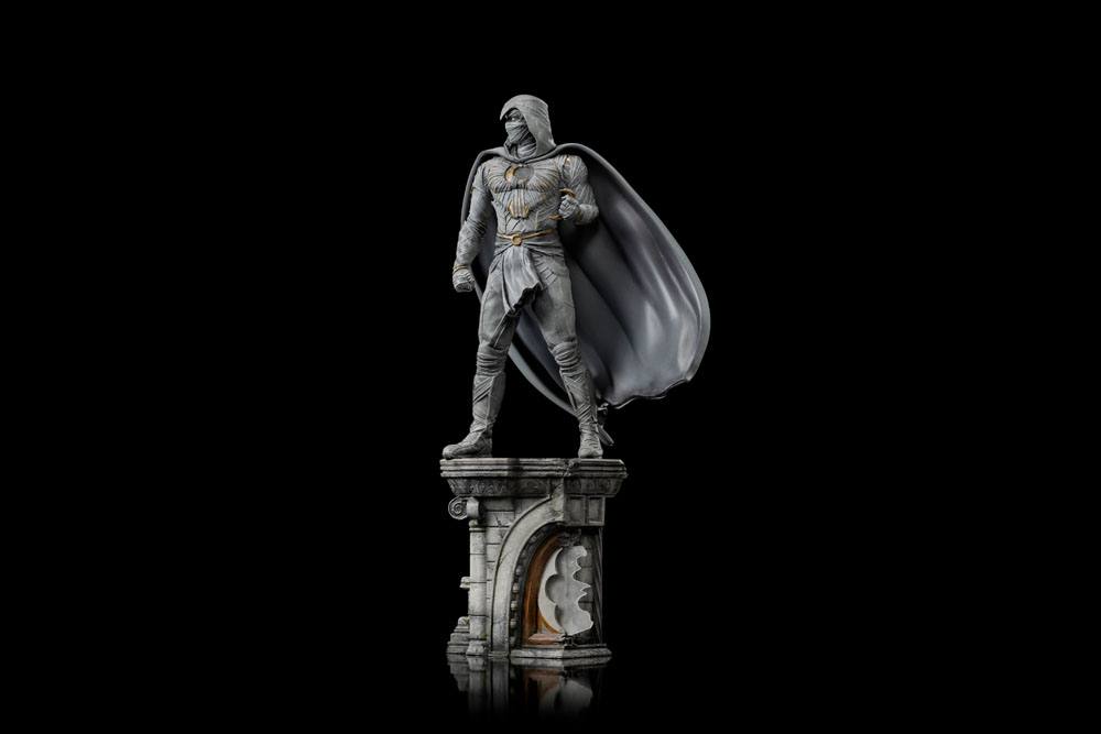 Iron Studios Moon Knight 1/10 scale statue in a white hooded costume standing on a detailed stone architectural base.