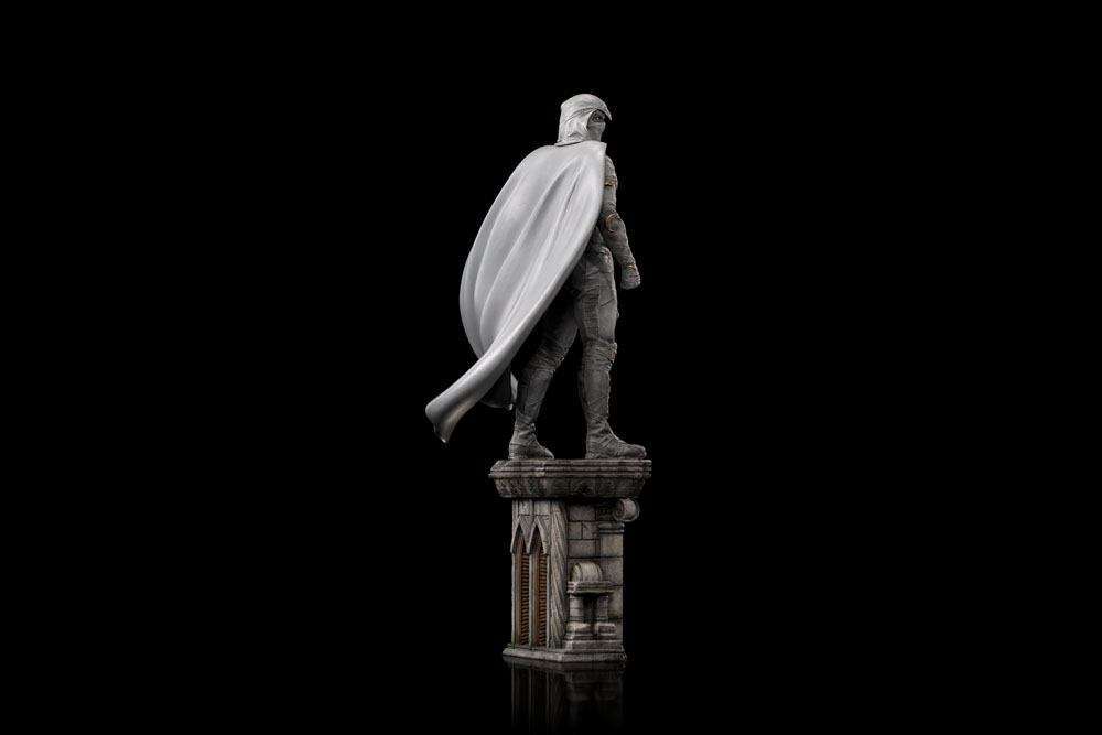 Side view of the 30 cm Iron Studios Moon Knight 1/10 scale statue featuring a flowing white cape on a stone pillar.