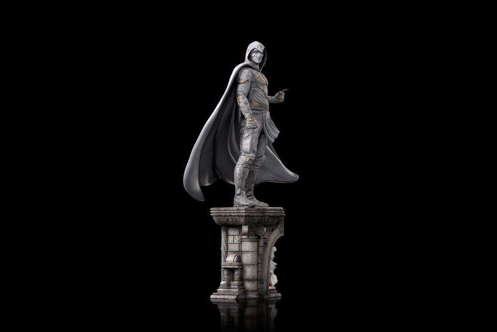 Side view of the 30 cm Iron Studios Moon Knight 1/10 scale statue in a white hooded costume on a stone-style base.