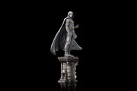 Side view of the 30 cm Iron Studios Moon Knight 1/10 scale statue in a white hooded costume on a stone-style base.