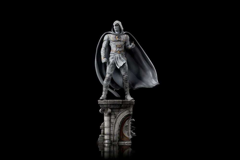 Iron Studios Moon Knight 1/10 scale statue in white costume with flowing cape, standing on a detailed stone base.