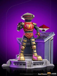 Iron Studios Alpha 5 1/10 scale statue in red, gold, and black standing on a detailed command center base.