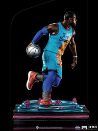 Iron Studios 1/10 LeBron James statue in a blue Tune Squad jersey, dribbling a basketball on a circular base.