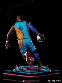 Back view of Iron Studios LeBron James 1/10 scale statue in a blue Tune Squad jersey, dribbling a silver basketball.