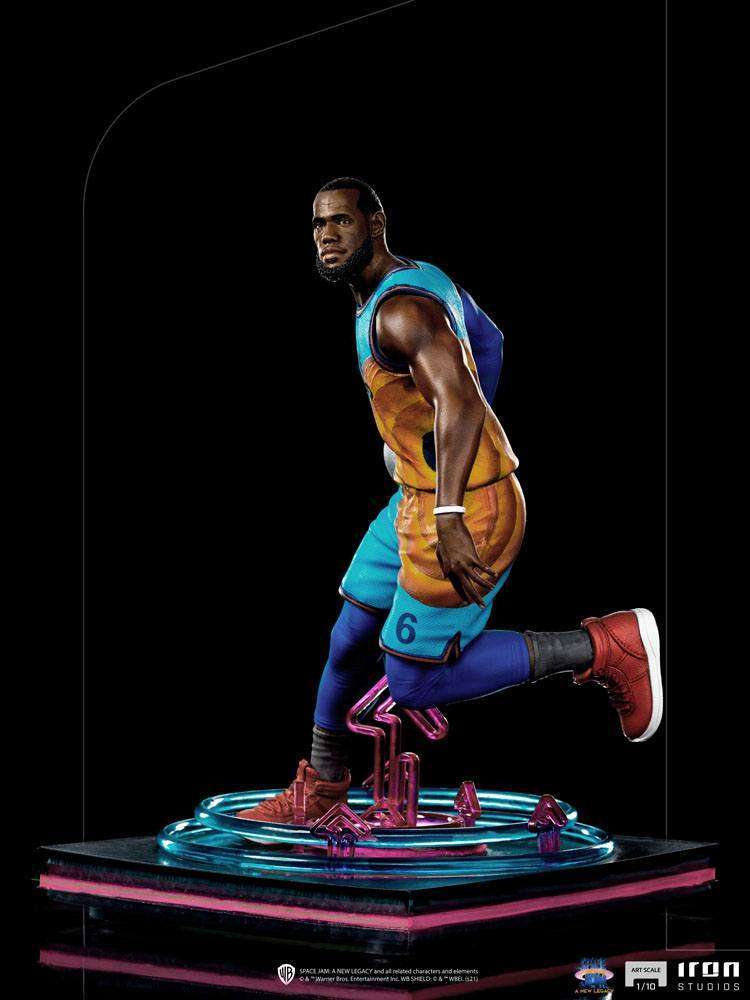 Iron Studios 1/10 LeBron James statue from Space Jam: A New Legacy, showing a side view of him in a blue and orange kit.