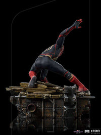 Side view of Iron Studios Spider-Man No Way Home 1/10 scale statue in a dynamic pose on a detailed rubble base.