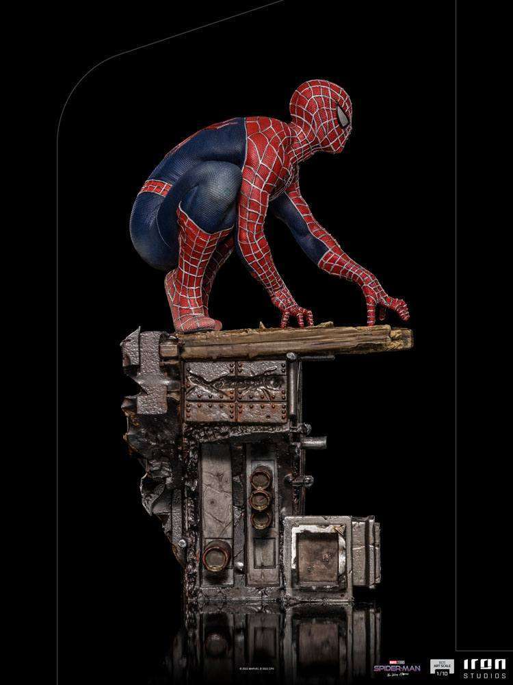 Side view of Iron Studios Spider-Man: No Way Home 1/10 scale statue crouching on a detailed industrial base.