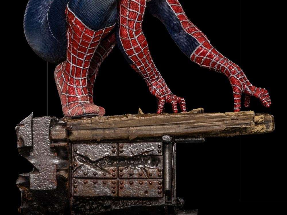 Close-up of Iron Studios Spider-Man BDS Art Scale statue showing the red and blue suit texture on a weathered base.