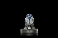 Front view of the 13 cm Iron Studios R2-D2 Star Wars Art Scale statue in white and blue on a circular display base.