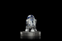 Iron Studios 1/10 scale R2-D2 statue from Star Wars, featuring blue and white detailing on a circular display base.