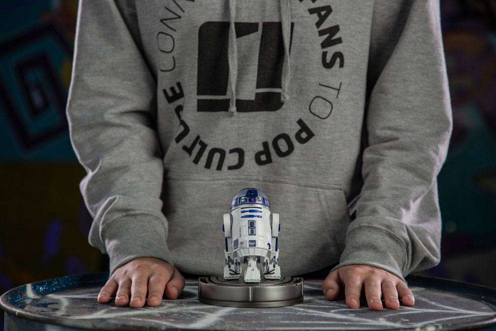 Front view of the 13 cm Iron Studios R2-D2 Star Wars Art Scale statue standing on a circular display base.