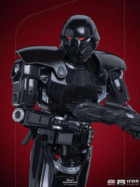 Close-up of the Iron Studios 1/10 scale Dark Trooper statue featuring sleek black armor and glowing red visor eyes.