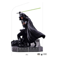 Iron Studios 1/10 Luke Skywalker Combat Version statue in a hooded black cloak wielding a green lightsaber.