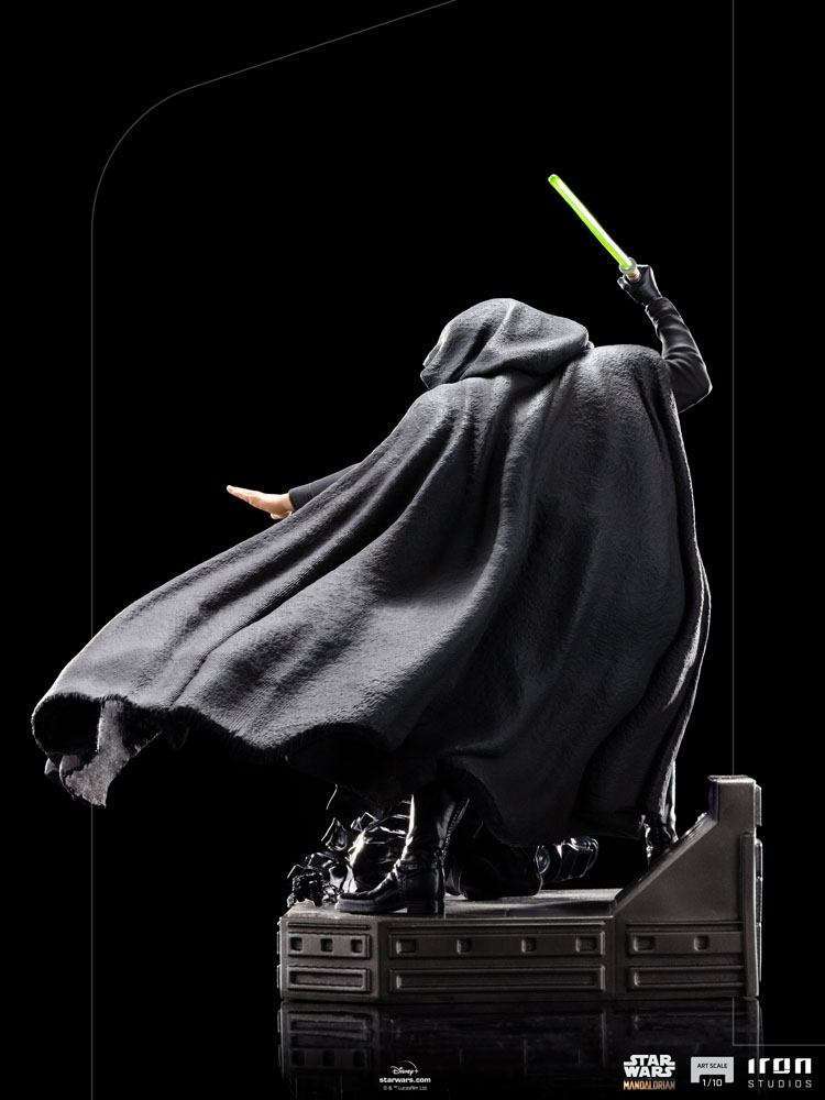 Back view of Iron Studios Luke Skywalker 1/10 scale statue in a black hooded cloak holding a glowing green lightsaber.